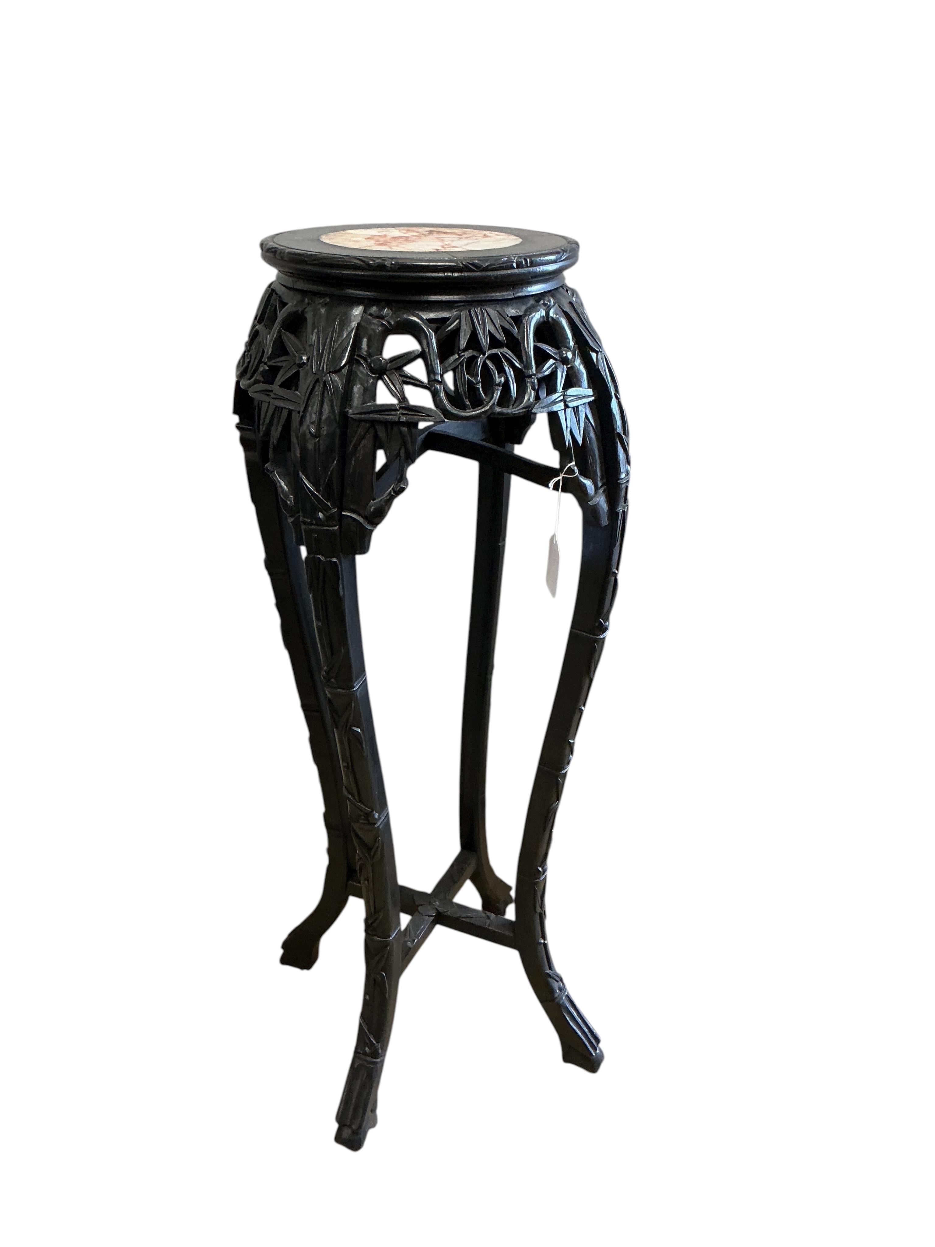 A Chinese marble topped vase stand, diameter 34cm, height 90cm